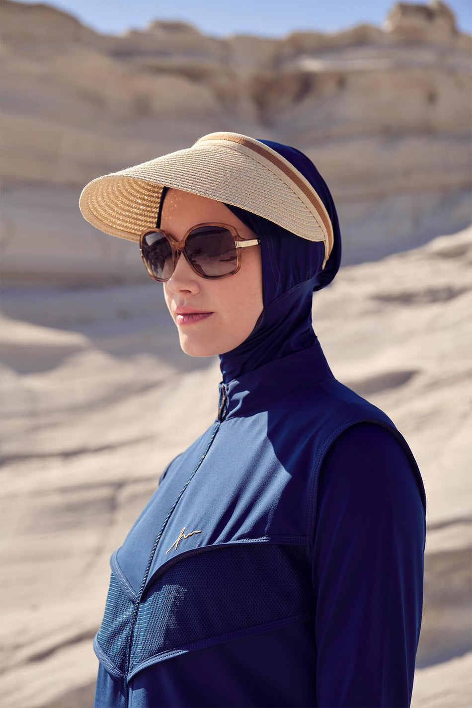 Beige Swimsuit with Striped Visor and Straw Hat