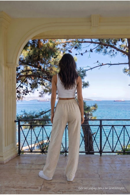 Loose-fitting, elasticated waist trousers in ecru linen blend. - MALLTURK